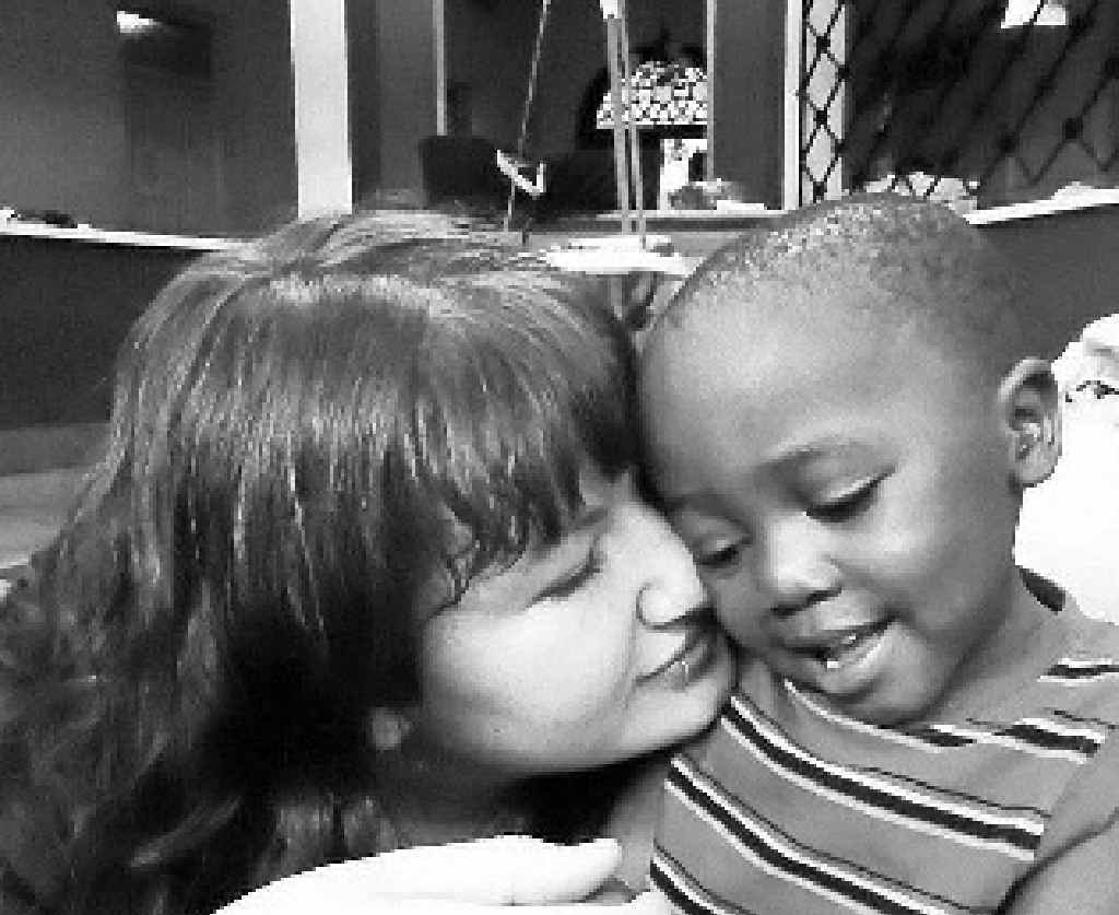 Georgianna Manthey with one of her charges, Cooper, at the Baby Watoto childcare ministry for abandoned babies. Georgianna Manthey with one of her charges, Cooper, at the Baby Watoto childcare ministry for abandoned babies.